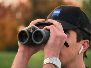 Using the baseball cap technique to stabilize your binoculars